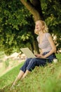 Why employees need to work outdoors. Girl laptop outdoors. Being outdoors exposes workers to fresher air and