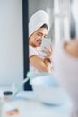 Why hello there gorgeous. a beautiful young woman taking selfies in the bathroom at home. Royalty Free Stock Photo