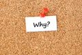 Why. Word written on a piece of paper, cork board background Royalty Free Stock Photo