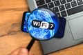 Wi-Fi 7 generation background, icon close-up. Smartphone supporting new Wi-Fi technology for communication, business