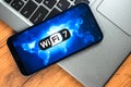 Wi-Fi 7 generation background, icon close-up. Smartphone supporting new Wi-Fi technology for communication, business