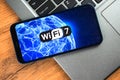 Wi-Fi 7 generation background, icon close-up. Smartphone supporting new Wi-Fi technology for communication, business