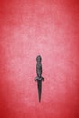 Wiccan dagger on a red background