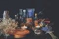 Wiccan witch apothecary - various ingredients, potions and dried herb bottles and jars for magick, placed on an altar. Royalty Free Stock Photo