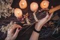 Wiccan witch decorating a DIY besom broom for Samhain celebration Royalty Free Stock Photo