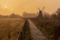 Wicken Fen windmill in early morning mist Royalty Free Stock Photo