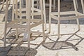 wicker bar stools and table illuminated by the sun