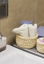 Wicker basket with blue and white towel