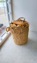 A wicker basket of bread stands in a cafe on the windowsill Royalty Free Stock Photo