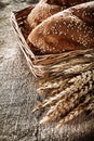 Wicker basket breadstick rye ears on sacking background Royalty Free Stock Photo