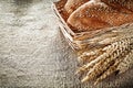 Wicker basket breadstick wheat ears on sacking background Royalty Free Stock Photo