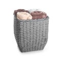 Wicker basket with clean rolled towels on white background Royalty Free Stock Photo