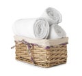 Wicker basket with clean rolled towels on white background Royalty Free Stock Photo