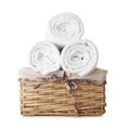 Wicker basket with clean rolled towels on white background Royalty Free Stock Photo