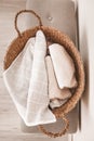 Wicker basket with clean towels in laundry room