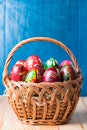 Wicker basket with colorful easter eggs