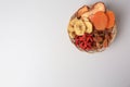 Wicker basket with different dried fruits on white background, top view. Space for text Royalty Free Stock Photo