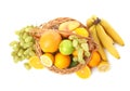 Wicker basket with different fruits on white background, top view Royalty Free Stock Photo