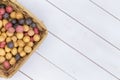 Wicker basket filled with assorted fresh potatoes Royalty Free Stock Photo