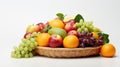 A wicker basket filled with a colorful variety of fresh fruits, including apples, grapes, and citrus, against a white background Royalty Free Stock Photo