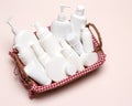 Wicker basket filled with cosmetics, different cosmetic products Royalty Free Stock Photo