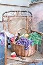 Wicker basket filled with grapes and wine bottle Royalty Free Stock Photo