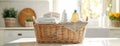 Wicker Basket Filled With Towels and Cleaning Products Royalty Free Stock Photo