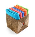 Wicker basket with folded clean towels on white background Royalty Free Stock Photo