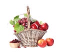 Wicker basket with fresh fruits and berries on white background Royalty Free Stock Photo