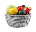 Wicker basket with fresh ripe vegetables and fruit on white background Royalty Free Stock Photo