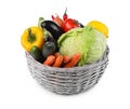 Wicker basket with fresh ripe vegetables and fruit on white background Royalty Free Stock Photo