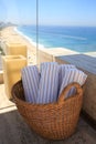 Wicker basket with fresh towels, with a backdrop of Copacabana beach - taken from above