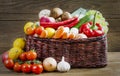 Wicker basket with fruits and vegetables on wooden table Royalty Free Stock Photo
