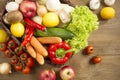 Wicker basket with fruits and vegetables on wooden table Royalty Free Stock Photo