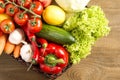 Wicker basket with fruits and vegetables on wooden table Royalty Free Stock Photo