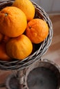 Empty Wicker Baskets Under One Basket Full Of Fresh Whole Mandarin Fruits Royalty Free Stock Photo