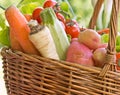 Wicker basket is full with organic vegetables Royalty Free Stock Photo