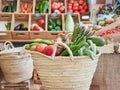 Wicker basket full of vegetables and fruits in a small local organic food store. Royalty Free Stock Photo