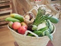 Wicker basket full of vegetables and fruits. Sustainable food shopping concept, plastic-free grocery store. Royalty Free Stock Photo