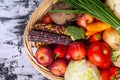 Wicker basket full of vegetables and fruits top view. Autumn and harvest time. Space for text Royalty Free Stock Photo