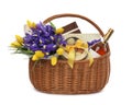 Wicker basket with gift, bouquet and wine on white background