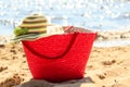 Wicker basket handbag bag and hat on summer beach. Royalty Free Stock Photo