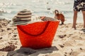 Wicker basket handbag bag and hat on summer beach. Royalty Free Stock Photo