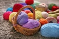 Wicker basket with knitting yarn on carpet Royalty Free Stock Photo