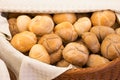 Wicker basket lined with a cloth filled with buns Royalty Free Stock Photo