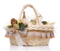 Wicker basket with original floral decor with natural components. Isolated on white background. Royalty Free Stock Photo