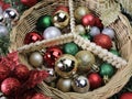 Peace basket with assorted colorful sparkly Christmas balls