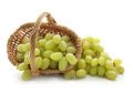 Wicker basket with ripe juicy grapes on white background Royalty Free Stock Photo
