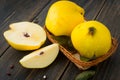 A wicker basket of yellow quince or queen apple autumn fruits, s Royalty Free Stock Photo