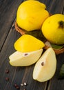 A wicker basket of yellow quince or queen apple autumn fruits, s Royalty Free Stock Photo